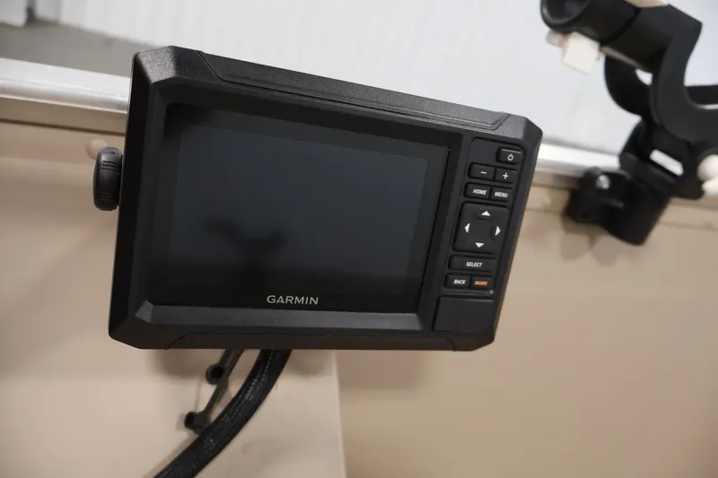 Slide: The Image of Garmin device mounted on 2019 Polar Kraft Outlander 156 T boat dashboard. - 19
