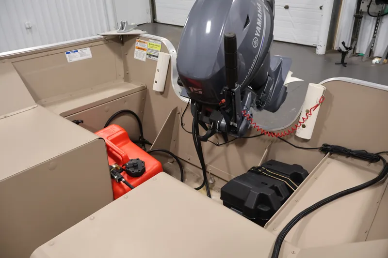 Slide: The Image of 2019 Polar Kraft Outlander 156 T boat interior with Yamaha motor and fuel tank. - 20