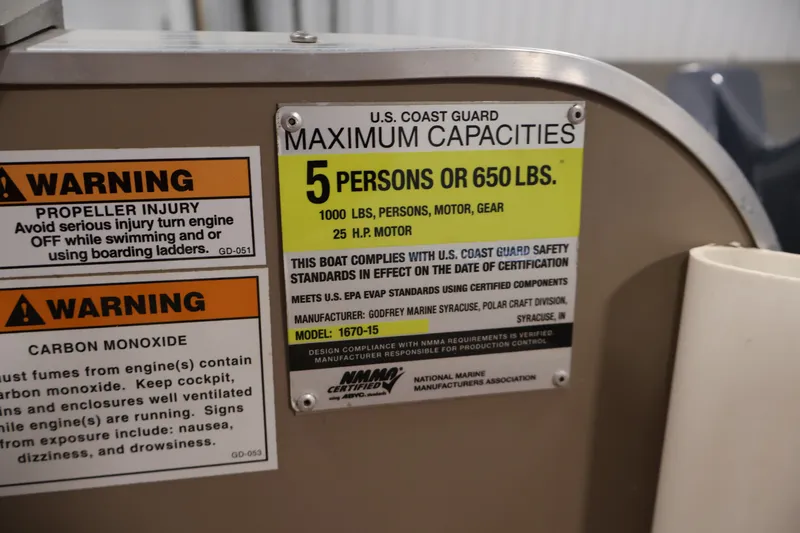 Slide: The Image of 2019 Polar Kraft Outlander 156 T capacity and safety warning labels, including U.S. Coast Guard limits. - 22