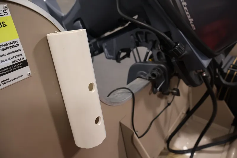 Slide: The Image of 2019 Polar Kraft Outlander 156 T boat interior with motor and safety certification label. - 21