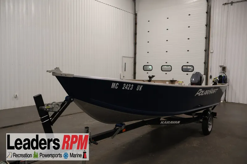 The Image of 2019 Polar Kraft Outlander 156 T boat on trailer in indoor showroom. - 1