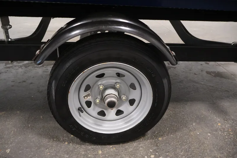 Slide: The Image of Trailer wheel of 2019 Polar Kraft Outlander 156 T boat, featuring a metal fender. - 29