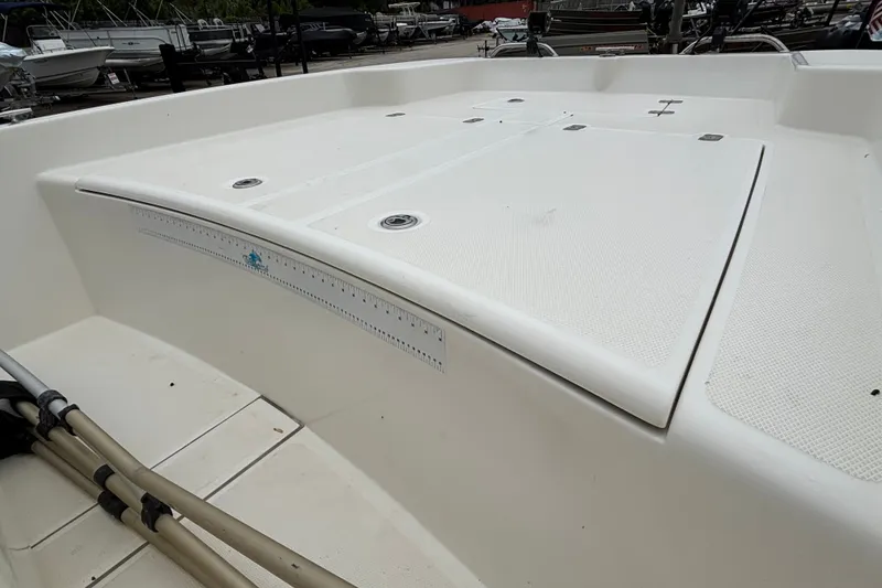 Slide: The Image of 2021 Mako Pro Skiff 17 CC boat deck with storage compartments and ruler detail. - 13