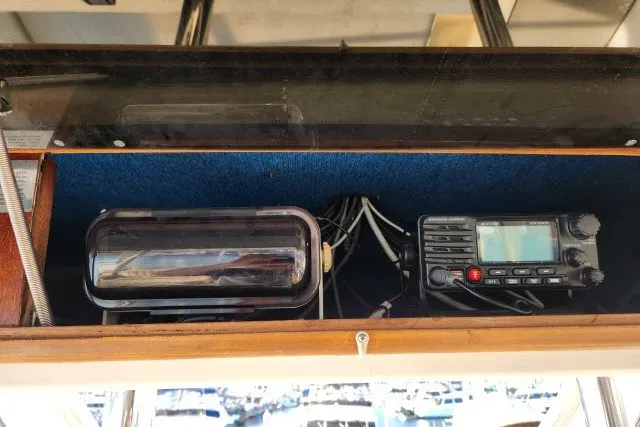 Slide: The Image of 1987 Ocean Yachts 48 Super Sport radio equipment and storage compartment. - 48