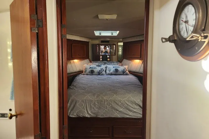 Slide: The Image of Cozy bedroom interior of 1987 Ocean Yachts 48 Super Sport with nautical decor. - 21