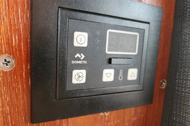 Slide: The Image of Control panel on 1987 Ocean Yachts 48 Super Sport, featuring Dometic interface. - 39