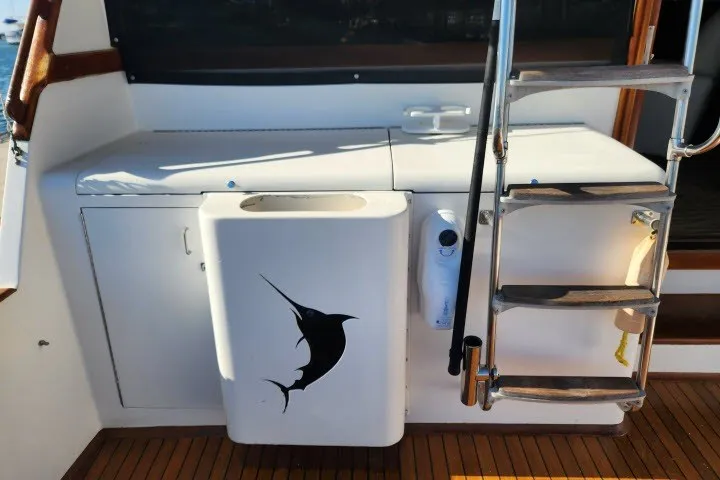 Slide: The Image of 1987 Ocean Yachts 48 Super Sport boat deck with marlin graphic and ladder. - 41