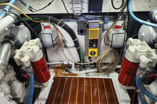 Slide: The Image of Engine room of a 1987 Ocean Yachts 48 Super Sport with mechanical components. - 66