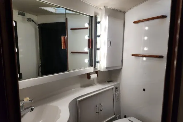 Slide: The Image of Bathroom interior of 1987 Ocean Yachts 48 Super Sport with mirror and lighting. - 26