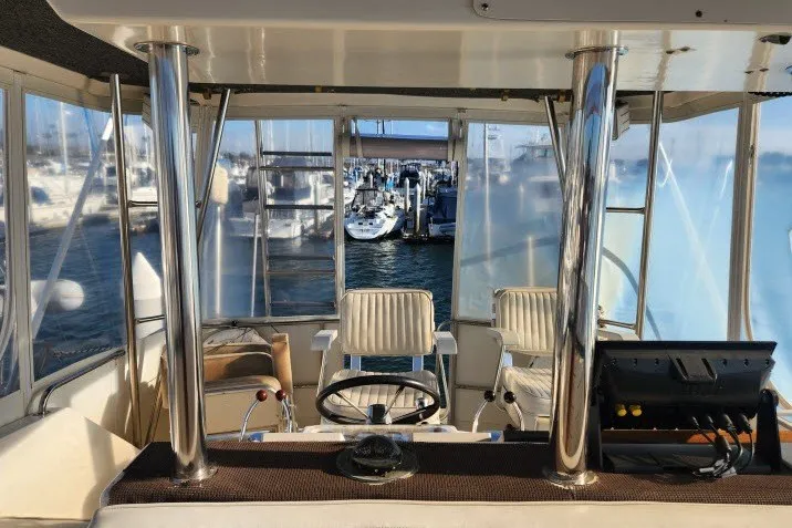 Slide: The Image of Cockpit view of 1987 Ocean Yachts 48 Super Sport at marina. - 51