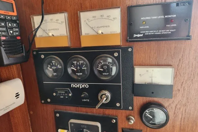 Slide: The Image of Control panel of a 1987 Ocean Yachts 48 Super Sport with gauges and monitors. - 37