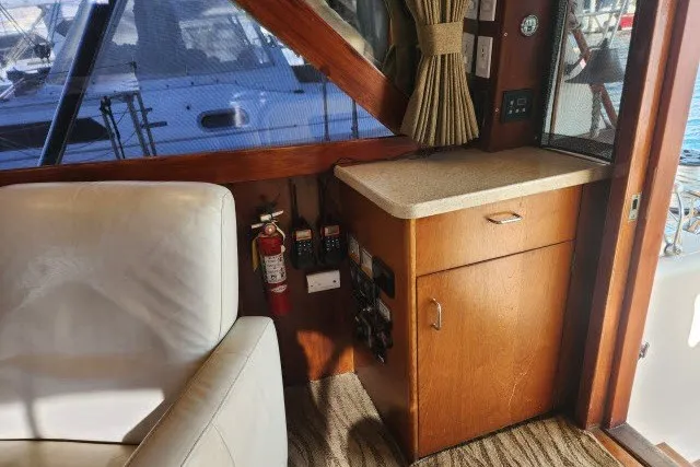 Slide: The Image of Interior of 1987 Ocean Yachts 48 Super Sport with wooden cabinetry and seating. - 35