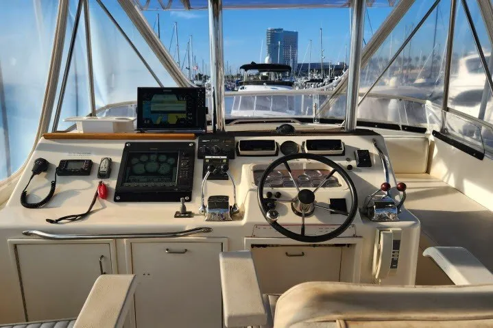 Slide: The Image of Cockpit of 1987 Ocean Yachts 48 Super Sport with navigation equipment and steering wheel. - 45