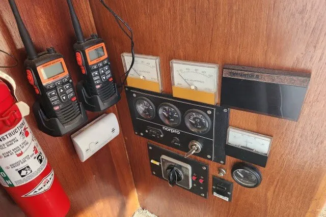 Slide: The Image of Control panel of a 1987 Ocean Yachts 48 Super Sport with radios and gauges. - 36