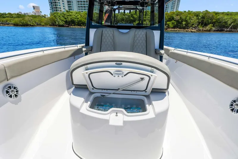 Slide: The Image of 2024 Sportsman Open 352 Center Console boat interior with seating and storage. - 33