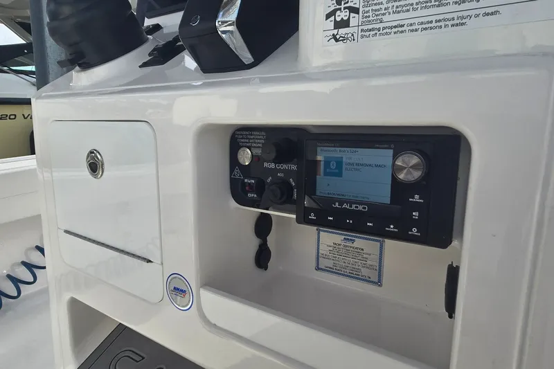 Slide: The Image of 2024 Caymas 281 HB boat dashboard featuring JL Audio system and control panel. - 24