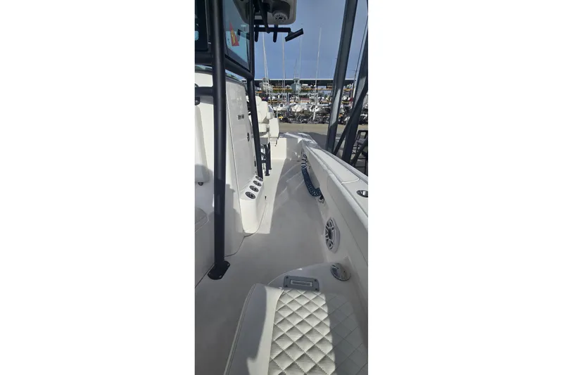 Slide: The Image of 2024 Caymas 281 HB boat interior with quilted seating and sleek design. - 32