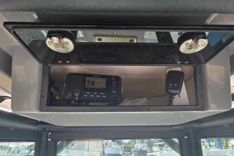 Slide: The Image of 2024 Caymas 281 HB boat console with Garmin marine radio and microphone. - 20
