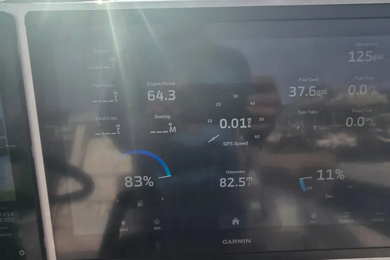 Slide: The Image of 2024 Caymas 281 HB dashboard display showing engine hours, fuel usage, and GPS speed. - 41