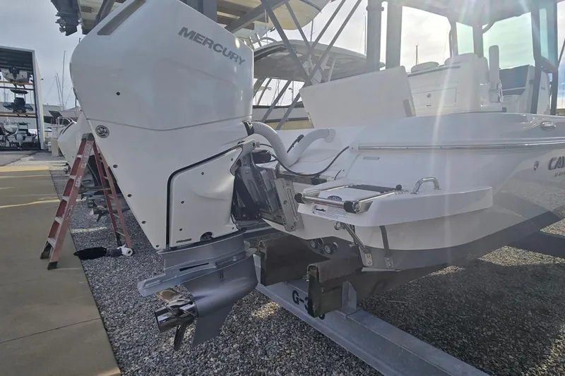 Slide: The Image of 2024 Caymas 281 HB boat with Mercury outboard engine on display. - 12