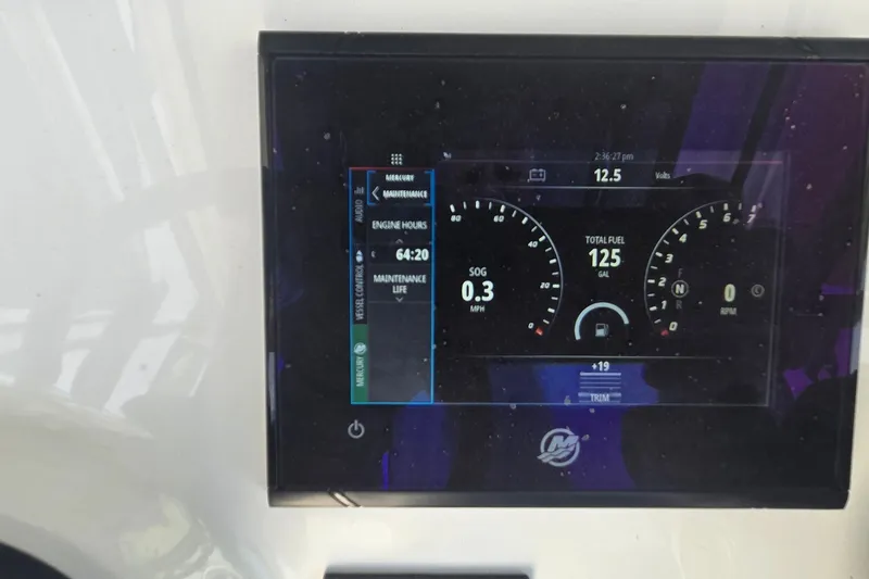 Slide: The Image of Dashboard display of 2024 Caymas 281 HB boat showing engine hours and fuel level. - 26