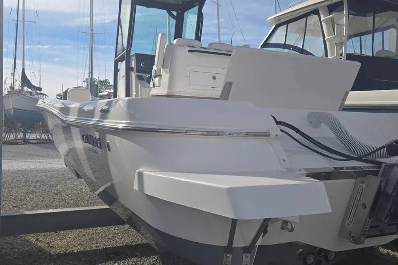 Slide: The Image of 2024 Caymas 281 HB boat docked, showcasing sleek design and modern features. - 9