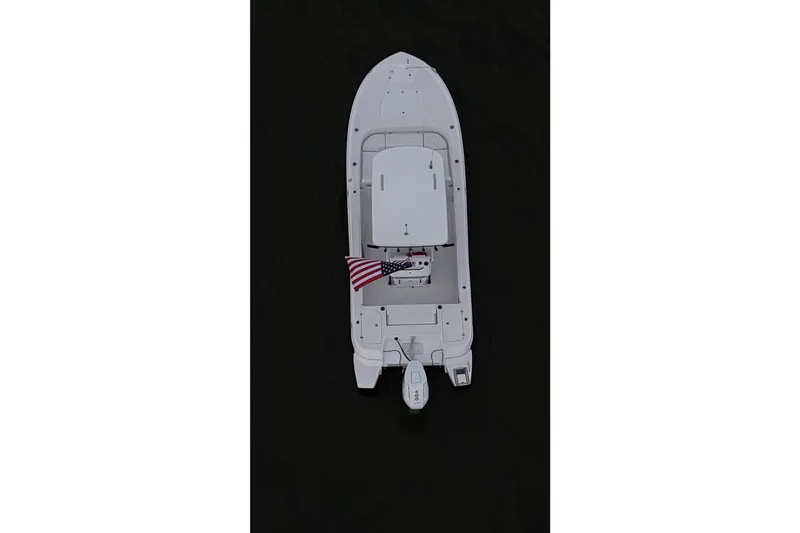 Slide: The Image of Top view of 2024 Caymas 281 HB boat with American flag on dark water. - 3