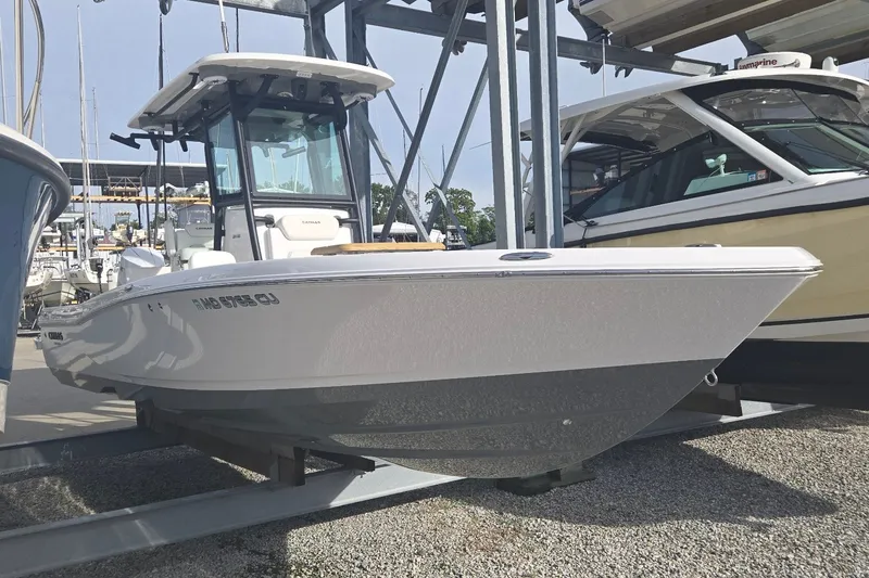 Slide: The Image of 2024 Caymas 281 HB boat displayed in a marina, showcasing sleek design and modern features. - 5