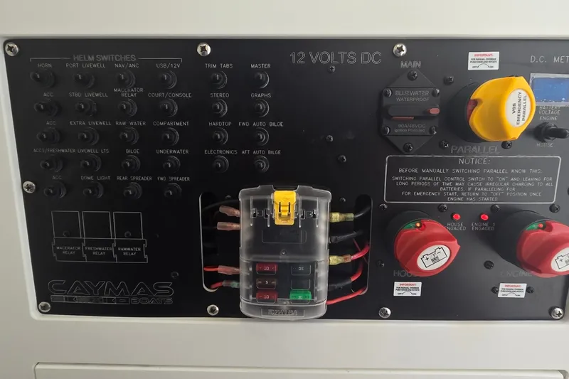 Slide: The Image of 2024 Caymas 281 HB boat control panel with switches and voltage meters. - 39