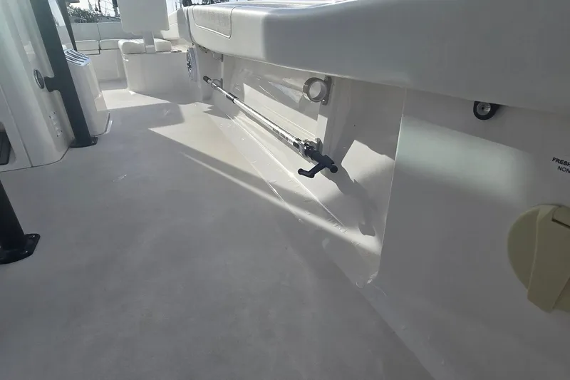 Slide: The Image of 2024 Caymas 281 HB boat interior with seating and storage features. - 33