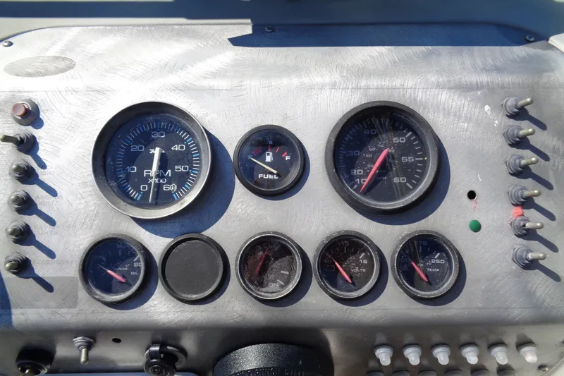 Slide: The Image of Dashboard of a 2007 Bayliner 2052 Trophy Walkaround DX/LX boat with gauges and switches. - 16