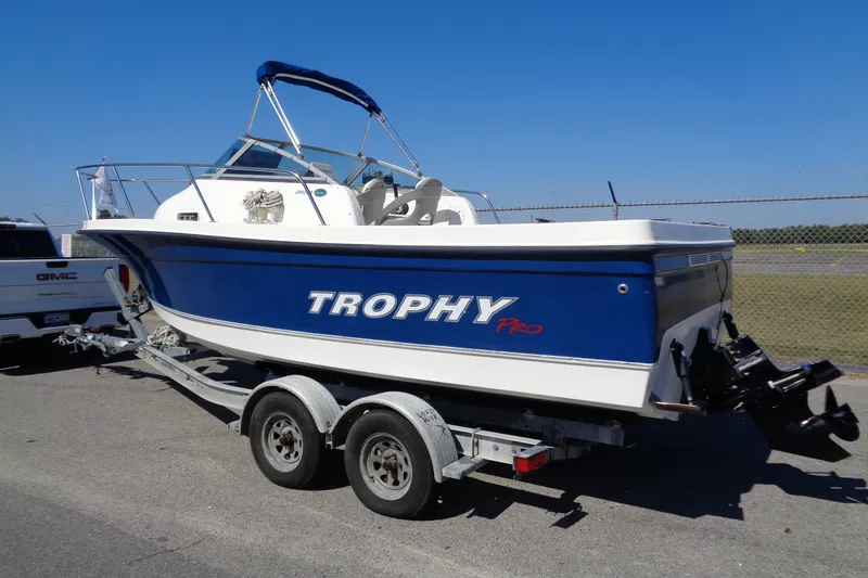 Slide: The Image of 2007 Bayliner 2052 Trophy Walkaround DX/LX boat on trailer, blue and white design. - 2