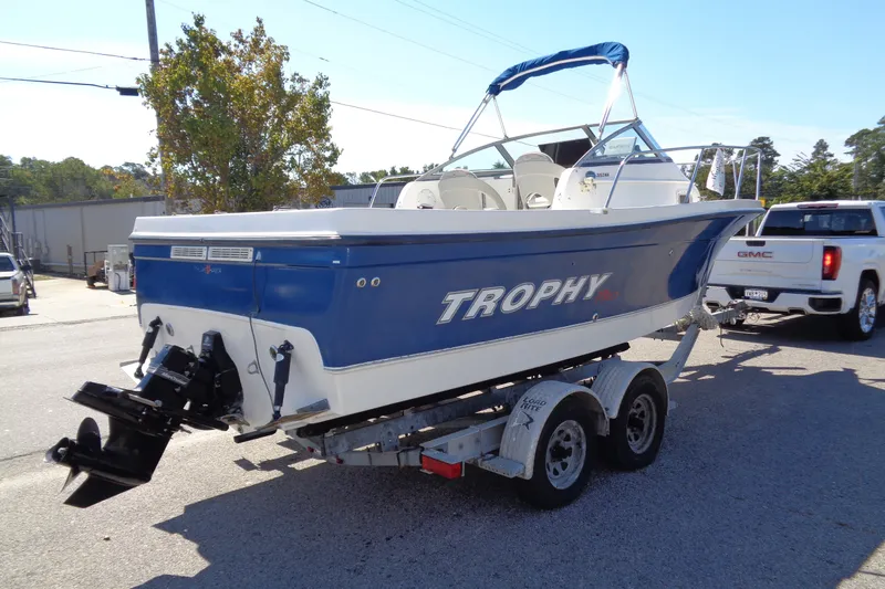 Slide: The Image of 2007 Bayliner 2052 Trophy Walkaround DX/LX boat on trailer, parked outdoors. - 3