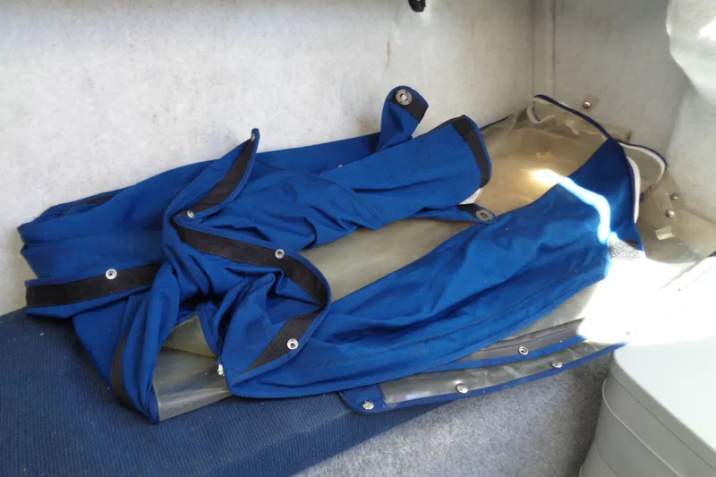 Slide: The Image of Blue canvas cover inside 2007 Bayliner 2052 Trophy Walkaround DX/LX boat cabin. - 11