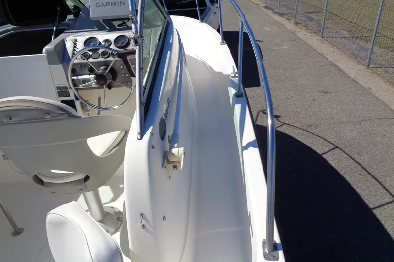 Slide: The Image of 2007 Bayliner 2052 Trophy Walkaround DX/LX boat interior with steering wheel and Garmin device. - 24