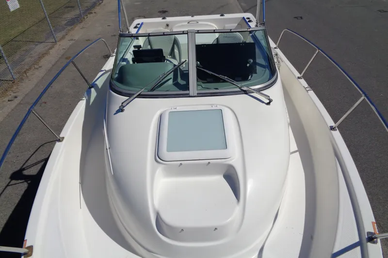 Slide: The Image of 2007 Bayliner 2052 Trophy Walkaround DX/LX boat, top view, docked on pavement. - 25