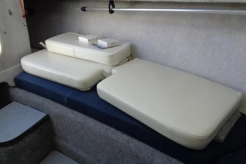 Slide: The Image of 2007 Bayliner 2052 Trophy Walkaround DX/LX cabin interior with cushioned seating. - 10
