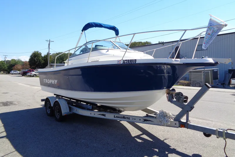 Slide: The Image of 2007 Bayliner 2052 Trophy Walkaround DX/LX boat on trailer, parked outdoors. - 4
