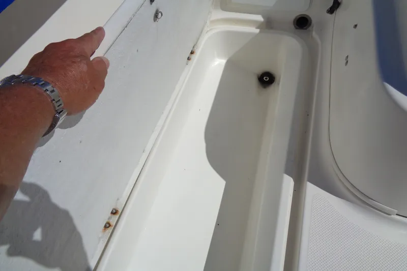 Slide: The Image of 2007 Bayliner 2052 Trophy Walkaround DX/LX boat interior detail with hand pointing. - 21