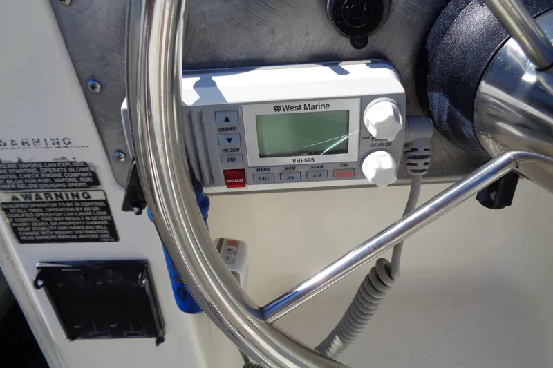 Slide: The Image of Steering wheel and VHF radio on 2007 Bayliner 2052 Trophy Walkaround DX/LX boat. - 15