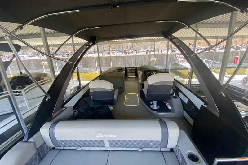 Slide: The Image of 2023 Barletta Lusso 25UCA pontoon boat interior with seating and helm station. - 11