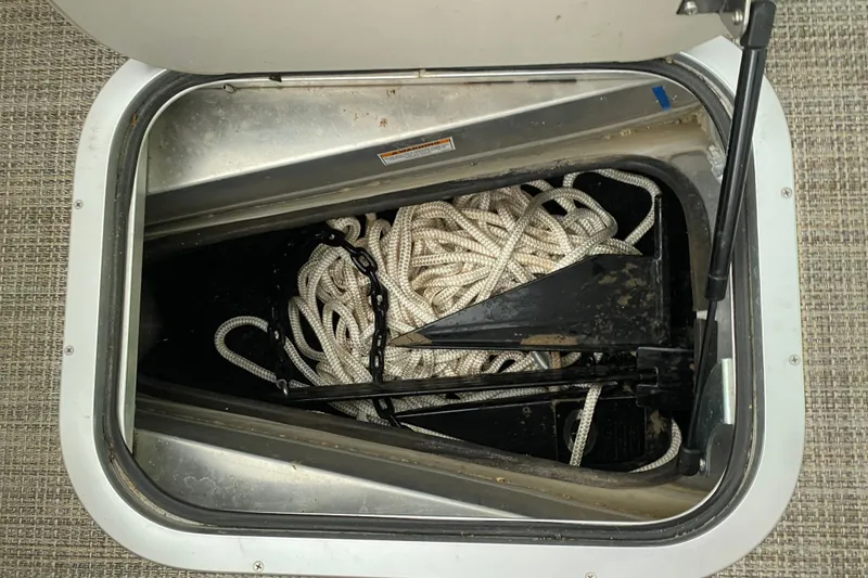Slide: The Image of Storage compartment with rope and anchor on 2023 Barletta Lusso 25UCA boat. - 38