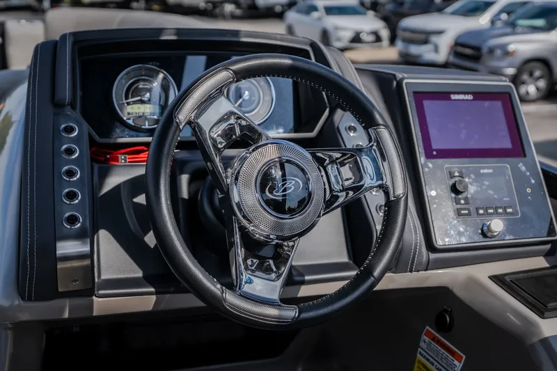 Slide: The Image of 2023 Barletta Lusso 25UCA dashboard with steering wheel and digital display. - 25