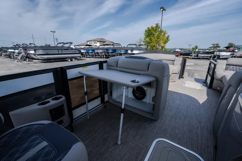 Slide: The Image of 2023 Barletta Lusso 25UCA pontoon boat interior with seating and table setup. - 31