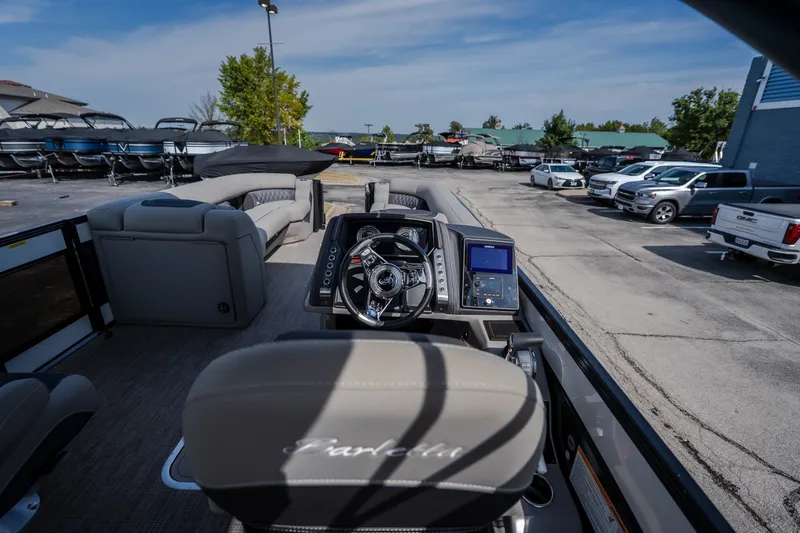 Slide: The Image of 2023 Barletta Lusso 25UCA pontoon boat interior with steering console and seating. - 23