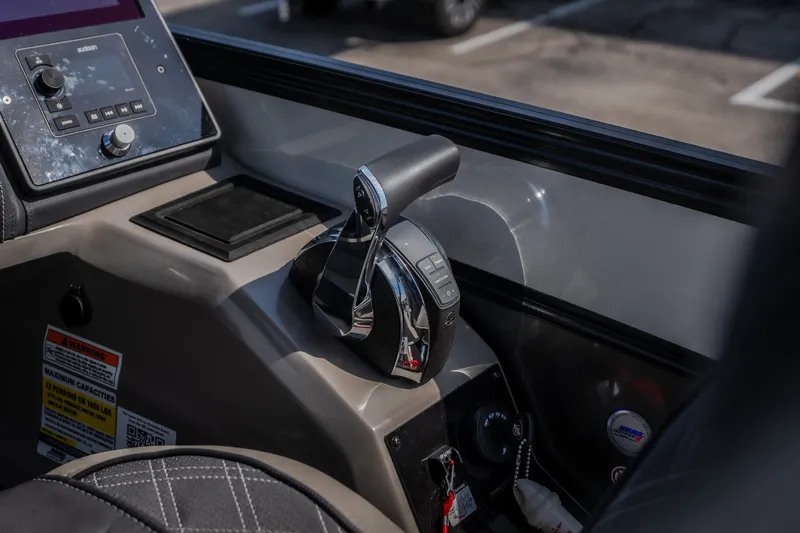 Slide: The Image of Control panel of 2023 Barletta Lusso 25UCA boat, featuring throttle and navigation controls. - 27