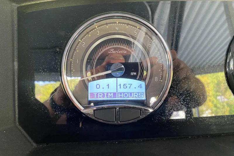 Slide: The Image of Close-up of 2023 Barletta Lusso 25UCA RPM gauge displaying 157.4 hours. - 14