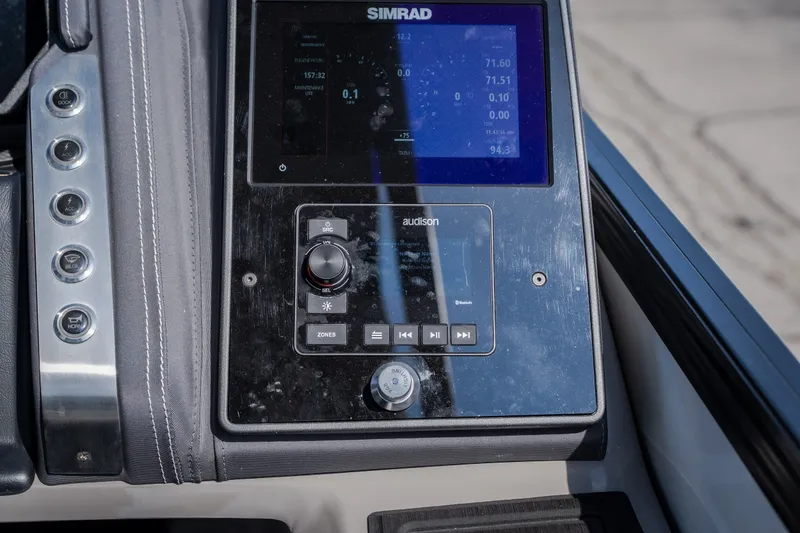 Slide: The Image of Control panel of 2023 Barletta Lusso 25UCA with Simrad display and Audison controls. - 26