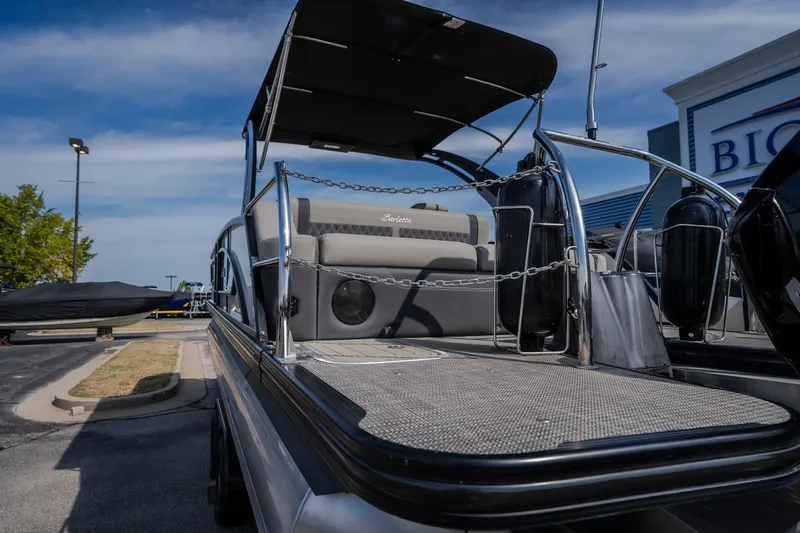 Slide: The Image of 2023 Barletta Lusso 25UCA pontoon boat with sleek design and spacious seating. - 16