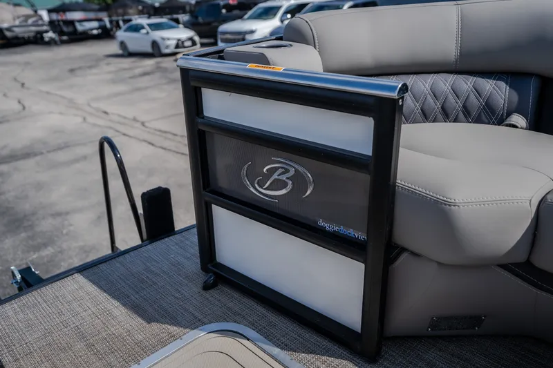 Slide: The Image of 2023 Barletta Lusso 25UCA boat interior with luxury seating and doggie dock view. - 37